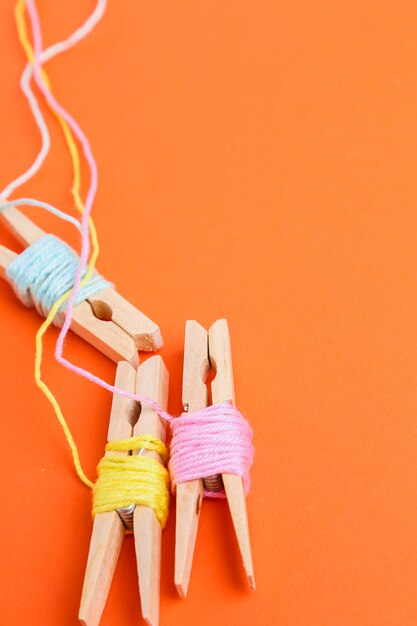 multicolor wool rolls on orange