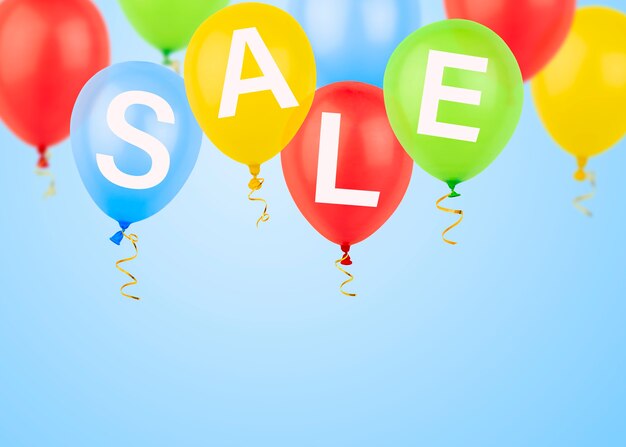 Multicolored balloons with the inscription sale on a light blue