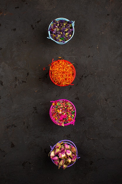 Free photo multicolored flowers leafs bright colorful on a dark floor