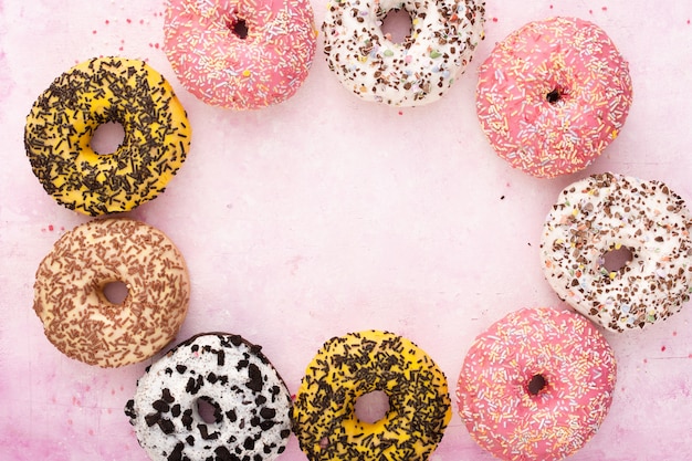 Multicolored glazed doughnuts with colorful sprinkles