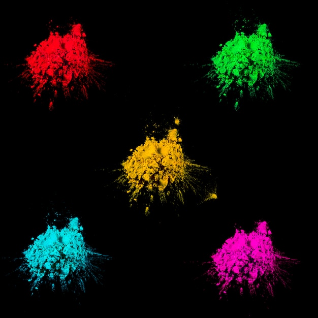 Multicolored holi colors decorated over black background