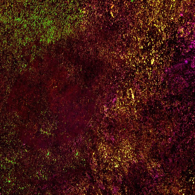 Multicolored holi powder splatted on background