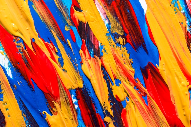 Multicolored paint brush strokes on surface