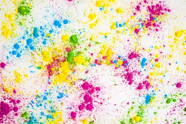 Multicolored powder splatter on white background