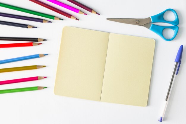 Multicolored stationery with notebook and scissors