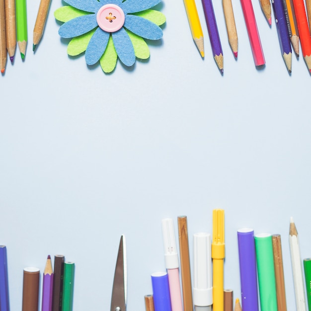 Multicolored writing implements with origami flower
