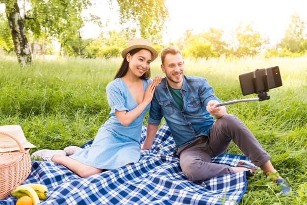 Multiethnic adult couple taking selfie