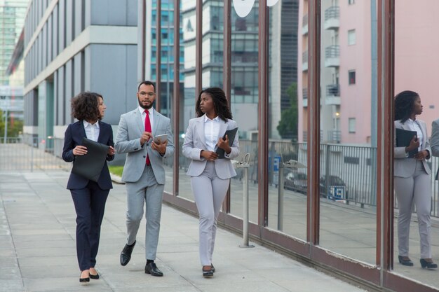 Multiethnic business people on street