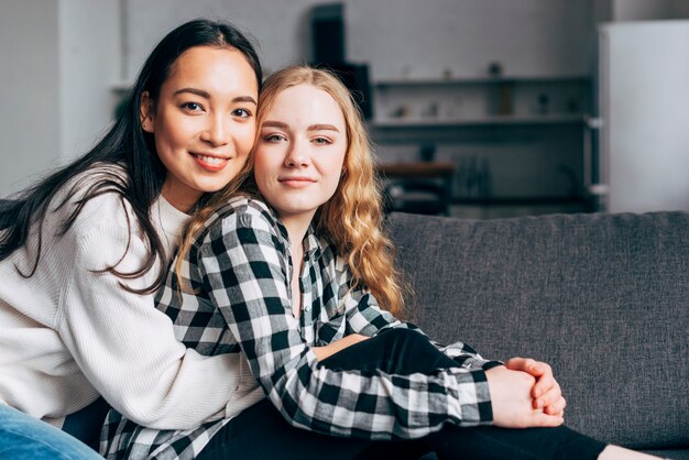 Multiethnic female friends hugging