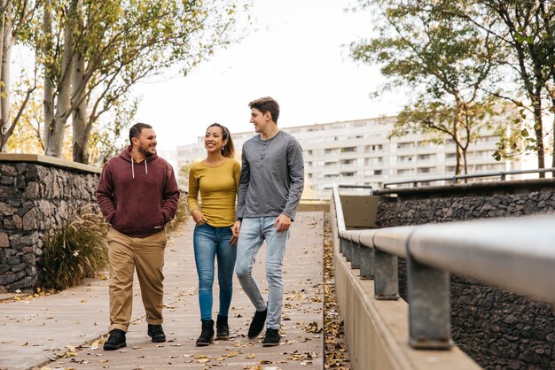 Multiethnic friends walking at autumn