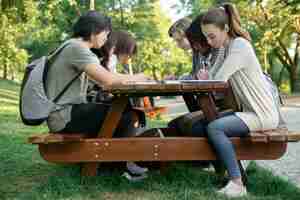 Free photo multiethnic group of happy young students