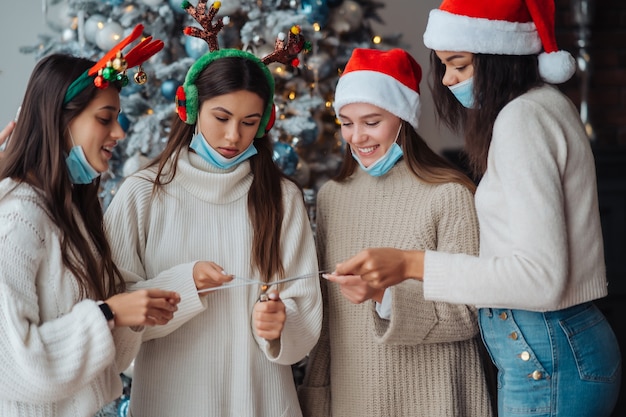 Multiethnic young people celebrating new year eve holding sparklers