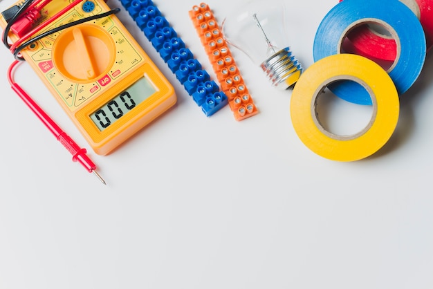 Free photo multimeter and tapes on table