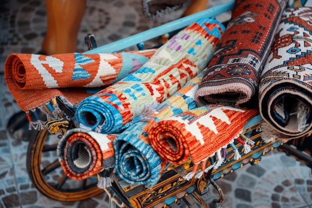 Multiple carpets at the Grand Bazaar in Istanbul Turkey