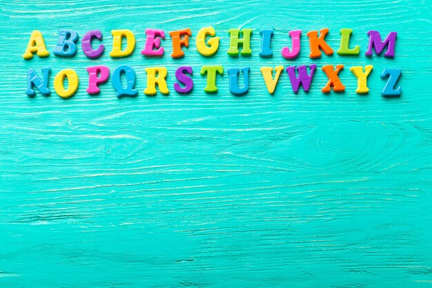 Multiple colored letters on wooden table