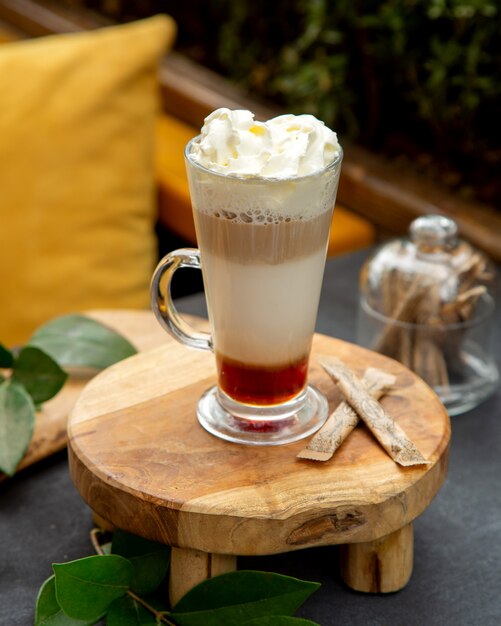 Multiple layer coffee cocktail topped with whipped cream