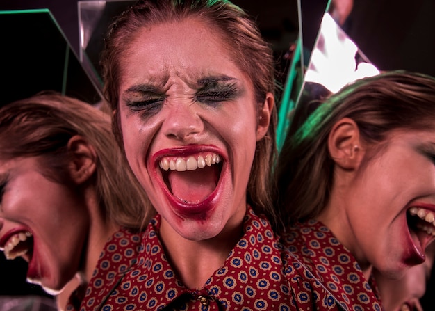 Free photo multiple mirror effect of woman screaming with eyes closed