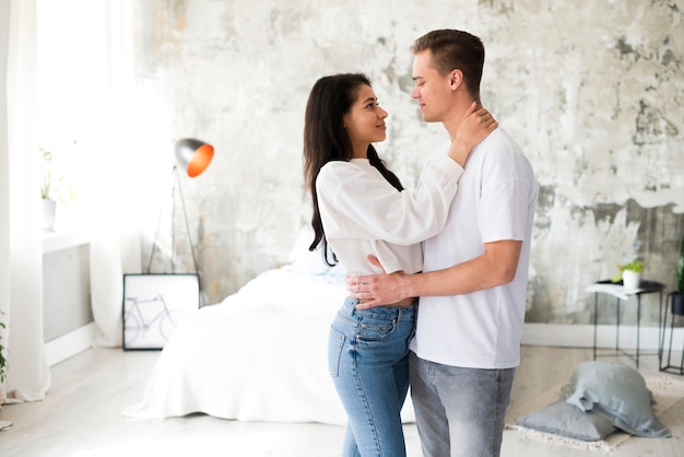 Free photo multiracial couple embracing each other