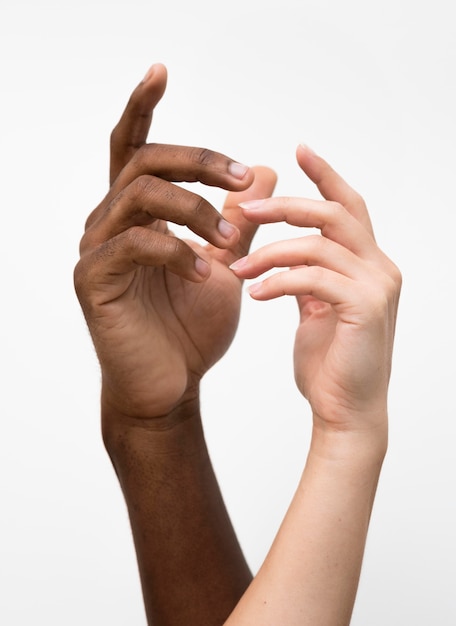 Multiracial hands coming together
