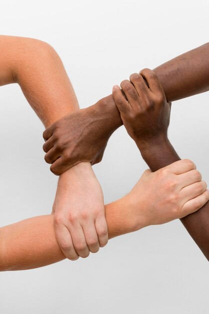 Multiracial hands coming together