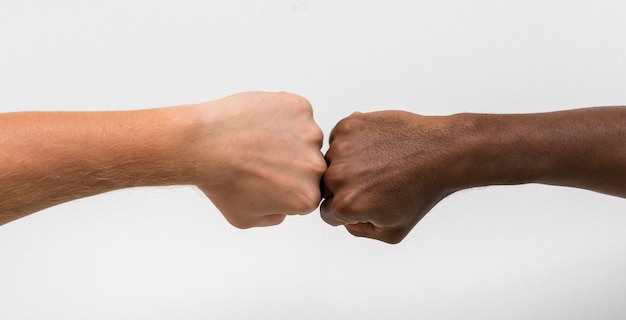 Multiracial hands coming together