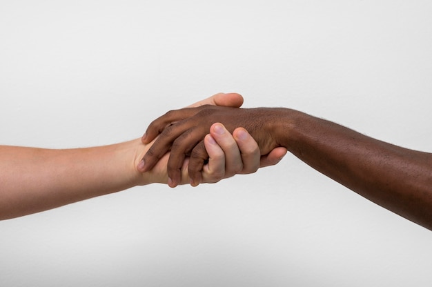 Multiracial hands coming together