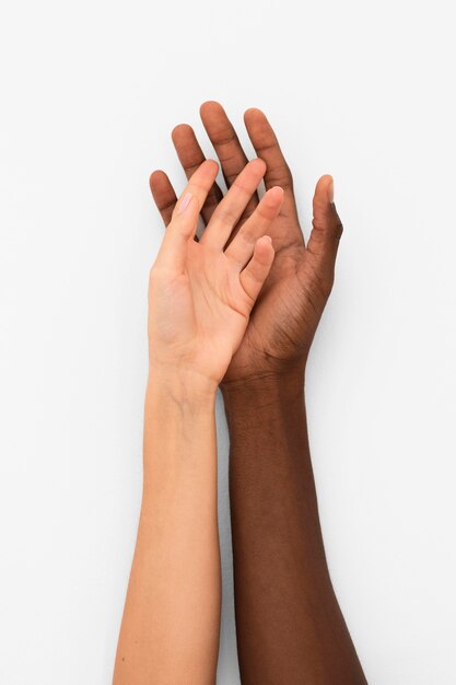 Multiracial hands coming together