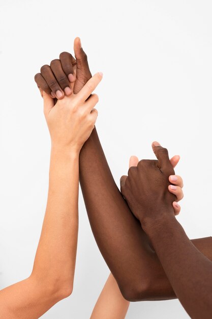 Multiracial hands coming together