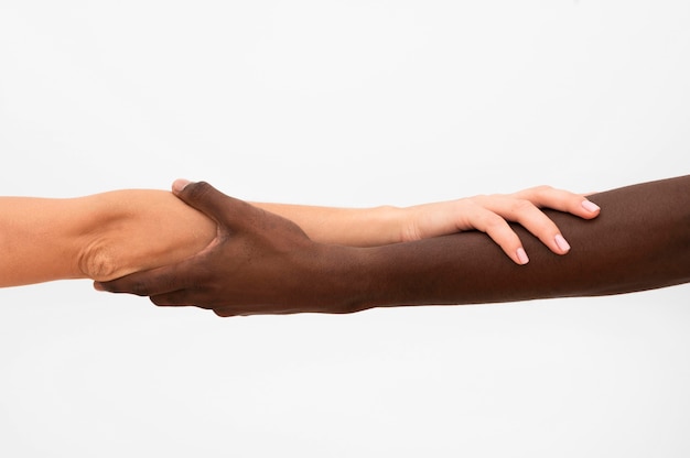 Multiracial hands coming together