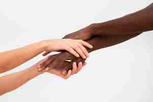 Free photo multiracial hands coming together