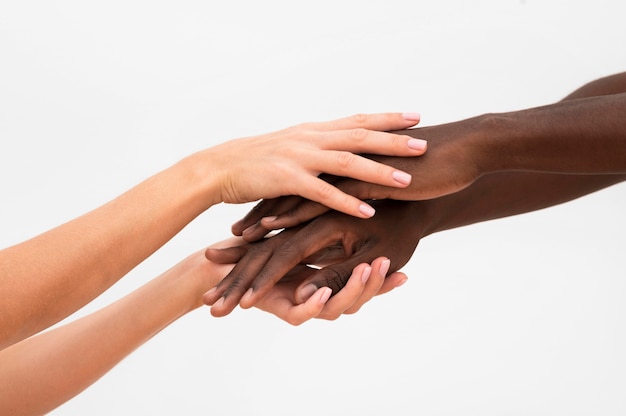 Free photo multiracial hands coming together