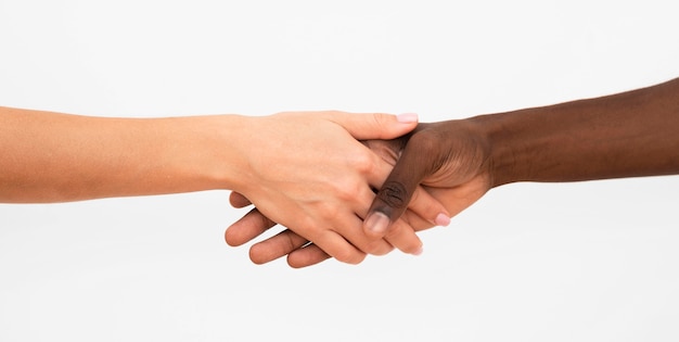 Multiracial hands coming together