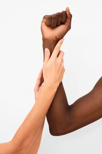 Multiracial hands coming together