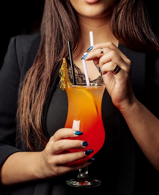 Multivitamin cocktail with ice on the table