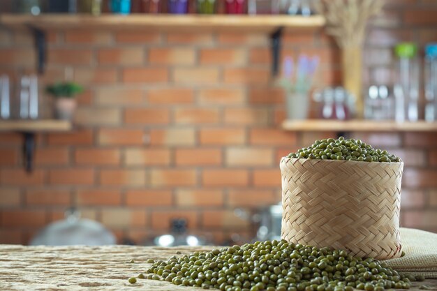 Mung bean seeds on a wooden background in the kitchen