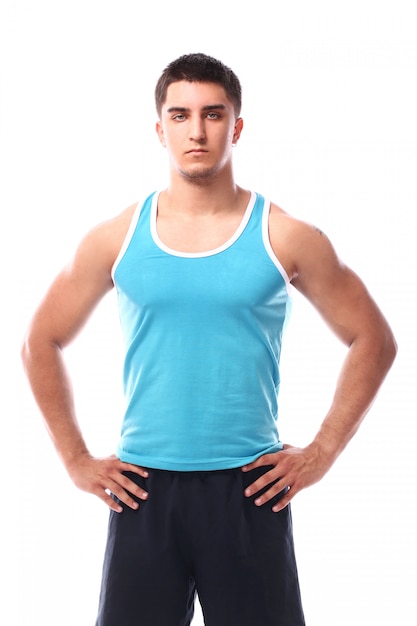 Muscular guy posing over white background