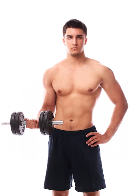 Free photo muscular guy working out with dumbbell