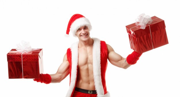 Muscular man disguised as santa claus with a red gift in each hand