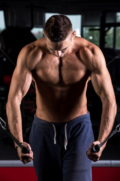 Muscular man doing chest