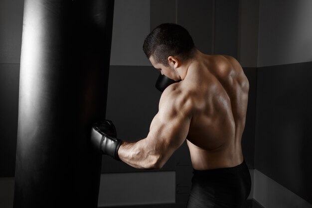 Muscular man practicing boxing