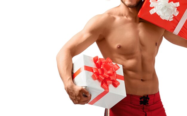 Muscular santa claus holding presents