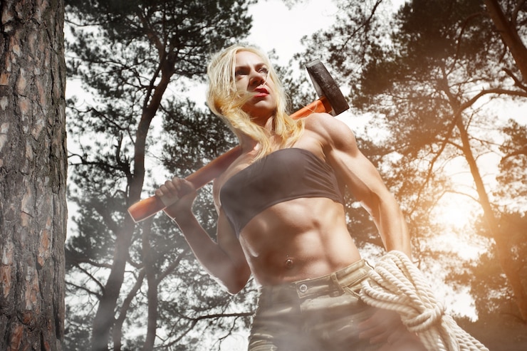 Free Photo muscular woman with an axe