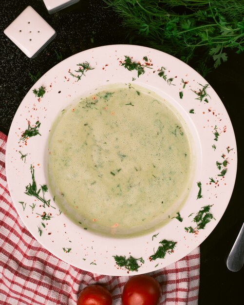 Mushroom soup with dill and tomatoes.