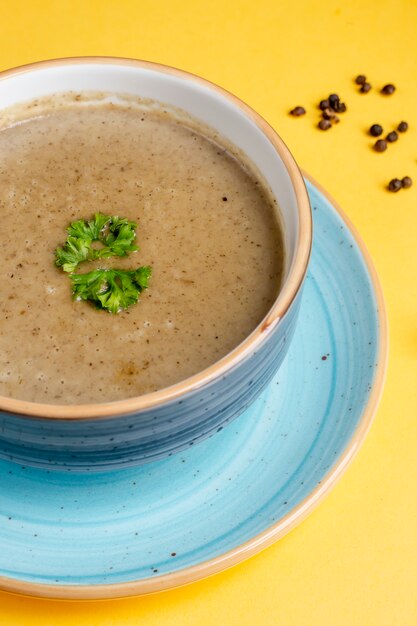 Mushroom soup with pepper and herbs