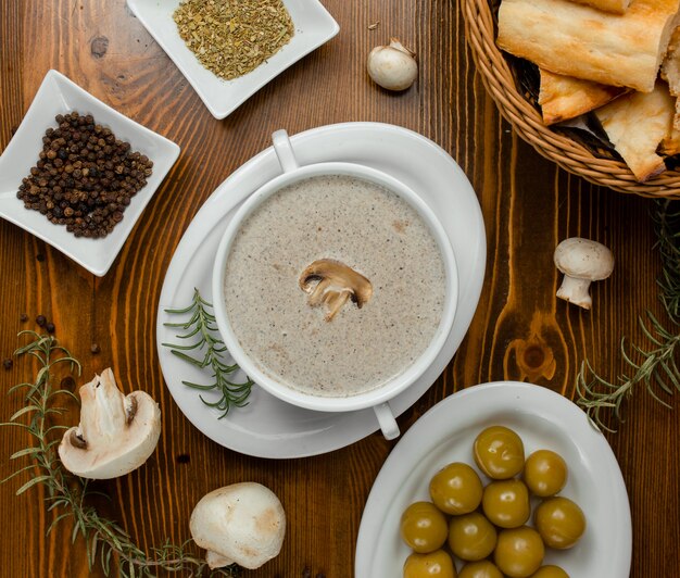 Mushroom soup with rosemary and bread.