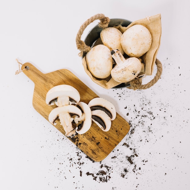 Mushrooms on board and in basket