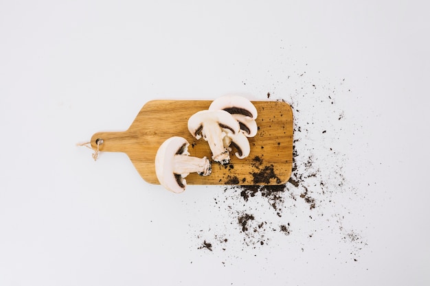 Mushrooms and soil on board