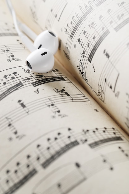 Music notes sheet and earphones