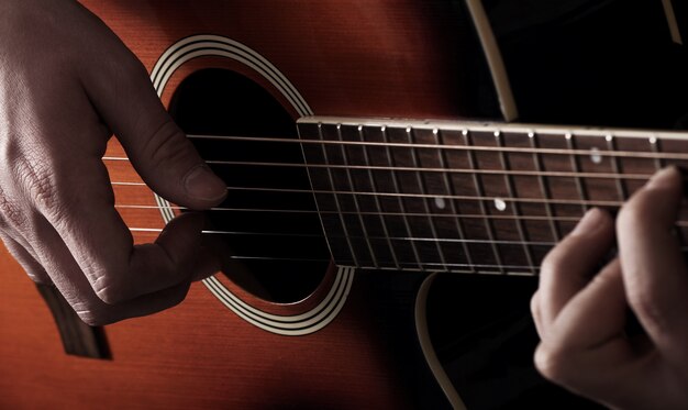 Musician playing on guitar