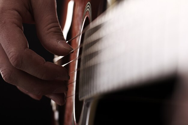 Musician playing on guitar